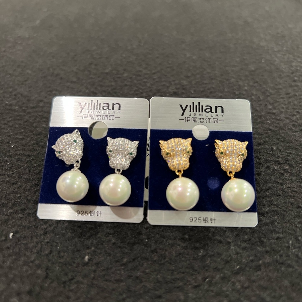 Panther Silver and Gold Pearl Earrings.